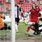 Jozef Rejdovian (druhý sprava) z FK Dukla Banská Bystrica a Denis Duga (vpravo) zo Spartaku Myjava počas zápasu 3. kola Fortuna ligy FK Dukla Banská Bystrica - Spartak Myjava (0:0). Banská Bystrica, 26. júl 2014.