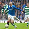 Biram Kayal (vľavo) sa pokúša vypichnúť loptu V. Weissovi ml. (Glasgow Rangers) počas zápasu škótskej Premier League. 2.januára 2011, Glasgow. FOTO: AP Photo/Chris Clark