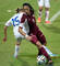 Deyna Castellanos of Venezuela battles with Denis Mrazikova of Slovakia during the FIFA Girls Summer Olympic Football Tournament Preliminary Round Group A match between Venezuela and Slovakia at Wutaishan Stadium on August 17, 2014 in Nanjing, China.