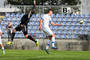 Brankár Litvy Milvydas Tupikas a hráč Slovenska Daniel Dubec. Kvalifikačný zápas reprezentácií do 17 rokov Slovensko - Litva 2:0 (0:0). Senec, 26. október 2014.