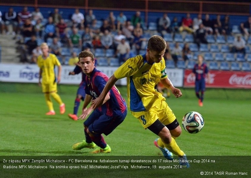 Zo zápasu MFK Zemplín Michalovce - FC Barcelona na  futbalovom turnaji dorastencov do 17 rokov Michalovce Cup 2014 na štadióne MFK Michalovce. Na snímke vpravo hráč Michaloviec Jozef Vajs. Michalovce, 19. augusta 2014.