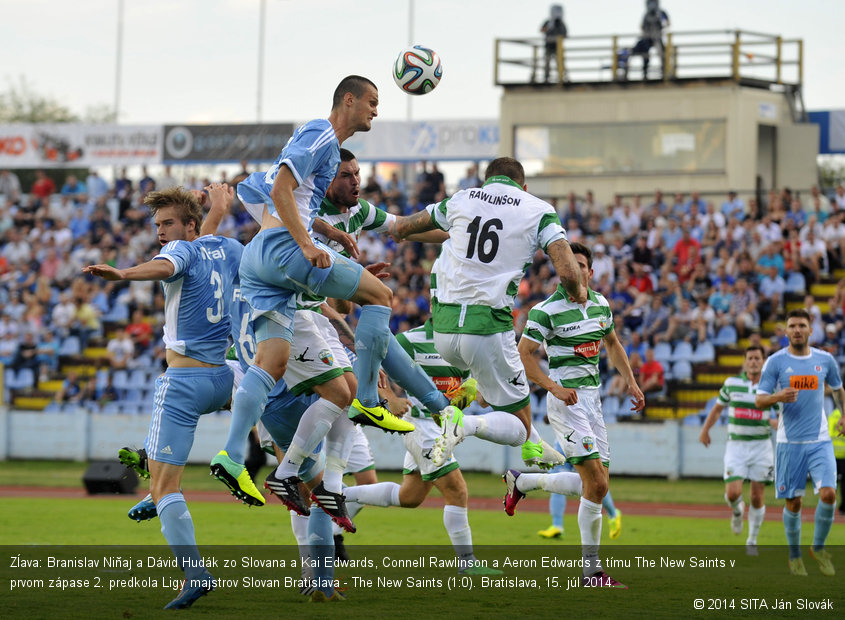 Zĺava: Branislav Niňaj a Dávid Hudák zo Slovana a Kai Edwards, Connell Rawlinson a Aeron Edwards z tímu The New Saints v prvom zápase 2. predkola Ligy majstrov Slovan Bratislava - The New Saints (1:0). Bratislava, 15. júl 2014.