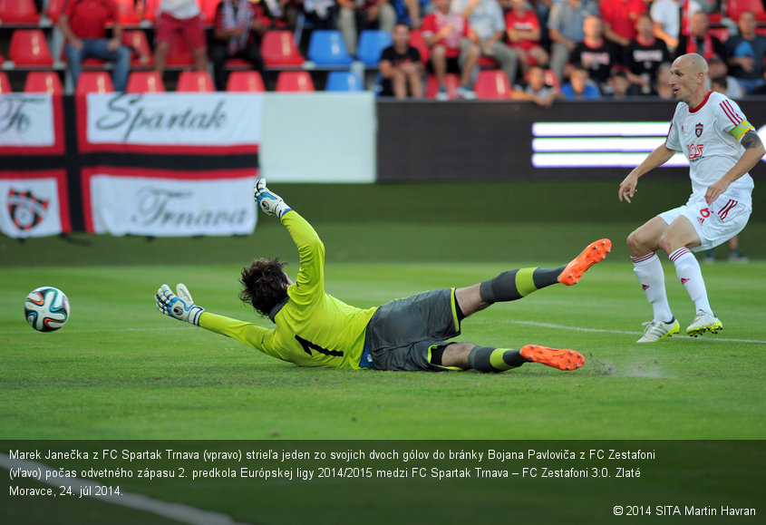 Marek Janečka z FC Spartak Trnava (vpravo) strieľa jeden zo svojich dvoch gólov do bránky Bojana Pavloviča z FC Zestafoni (vľavo) počas odvetného zápasu 2. predkola Európskej ligy 2014/2015 medzi FC Spartak Trnava – FC Zestafoni 3:0. Zlaté Moravce, 24. júl 2014.