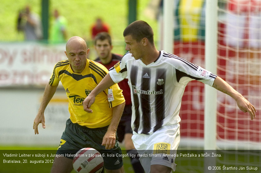 Vladimír Leitner v súboji s Jurajom Halenárom v zápase 6. kola Corgoň ligy medzi tímami Artmedia Petržalka a MŠK Žilina. Bratislava, 20. augusta 2012.