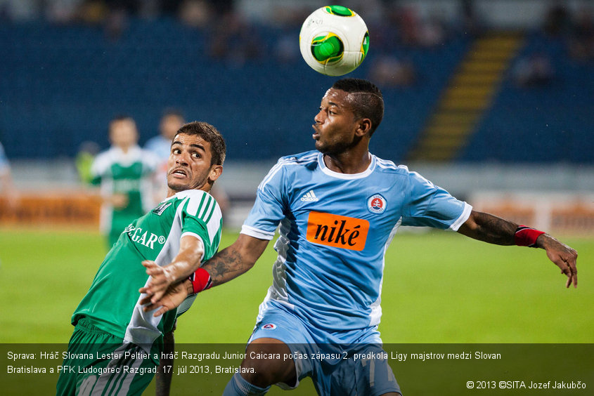 Sprava: Hráč Slovana Lester Peltier a hráč Razgradu Junior Caicara počas zápasu 2. predkola Ligy majstrov medzi Slovan Bratislava a PFK Ludogorec Razgrad. 17. júl 2013, Bratislava.